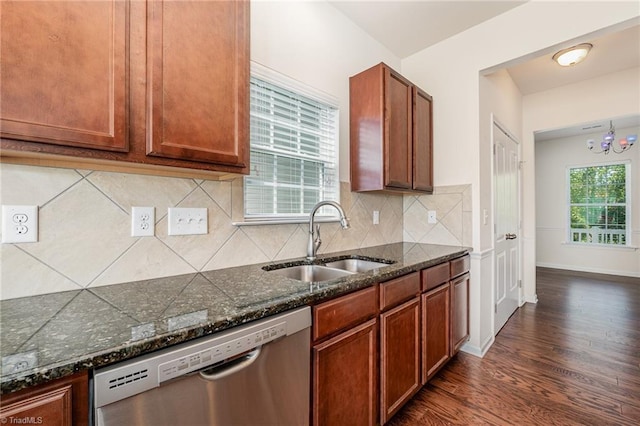 kitchen featuring brown cabinets, dishwasher, dark wood-style flooring, and a sink