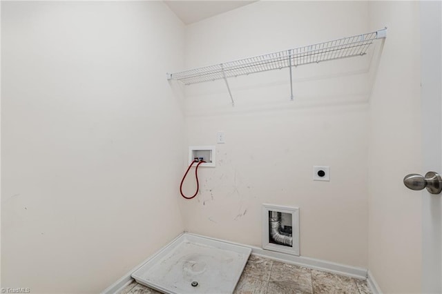 laundry room featuring laundry area, hookup for a washing machine, baseboards, and hookup for an electric dryer