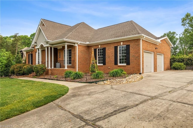 view of front of home featuring a porch, brick siding, concrete driveway, an attached garage, and a shingled roof