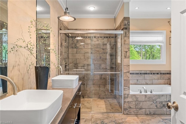 full bath featuring a sink, ornamental molding, double vanity, and a relaxing tiled tub