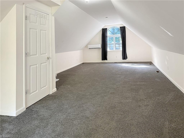 bonus room featuring vaulted ceiling and dark colored carpet