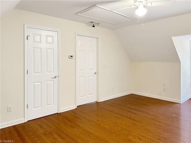 additional living space featuring vaulted ceiling, wood-type flooring, and ceiling fan