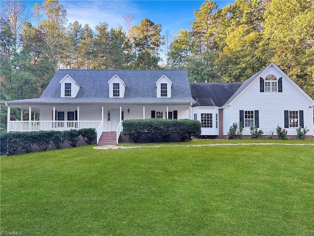 cape cod home featuring a front lawn and covered porch