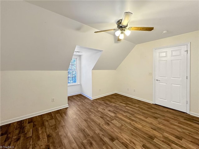 bonus room with dark wood-type flooring, ceiling fan, and lofted ceiling