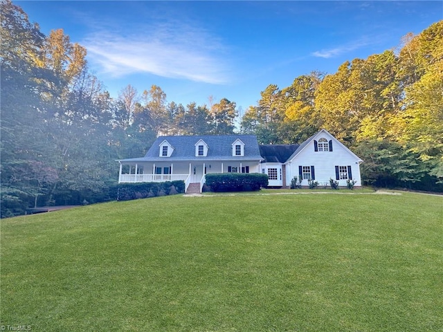 new england style home featuring a front lawn