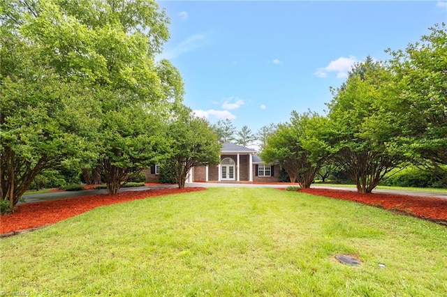 7060 Orchard Path Dr, Clemmons, NC 27012 - view of front of property with french doors and a front yard