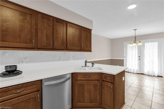 7060 Orchard Path Dr, Clemmons, NC 27012 - kitchen with dishwasher, a sink, a peninsula, light countertops, and tasteful backsplash
