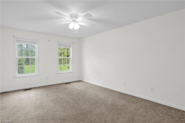 7060 Orchard Path Dr, Clemmons, NC 27012 - unfurnished room featuring a ceiling fan, carpet, baseboards, and a textured ceiling