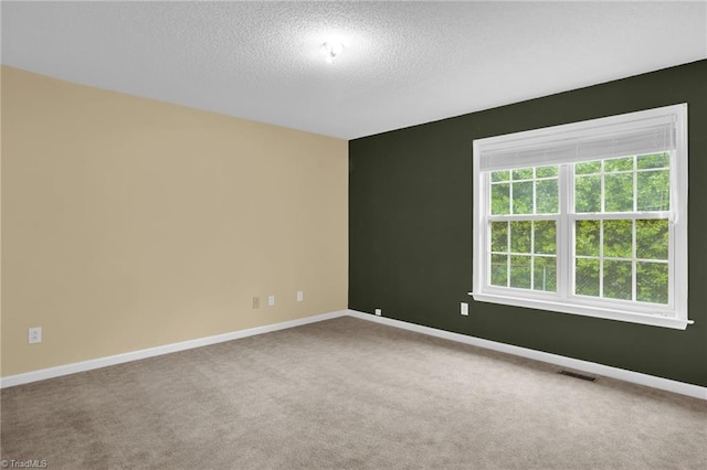 7060 Orchard Path Dr, Clemmons, NC 27012 - carpeted spare room with baseboards and a textured ceiling