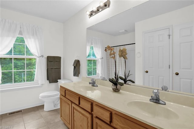 7060 Orchard Path Dr, Clemmons, NC 27012 - full bath featuring double vanity, toilet, tile patterned flooring, and curtained shower