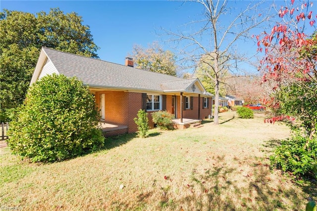 view of property exterior with a yard