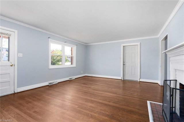 interior space with a brick fireplace, a wealth of natural light, dark wood-type flooring, and crown molding