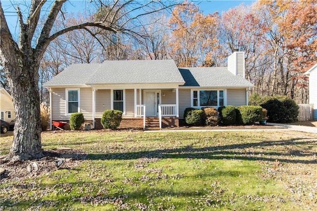 single story home featuring a porch and a front lawn