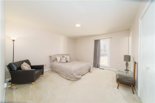 bedroom featuring light carpet