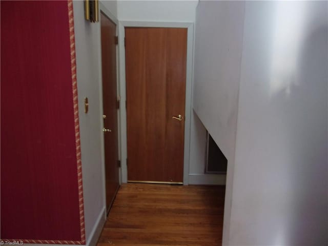 hallway featuring dark hardwood / wood-style floors