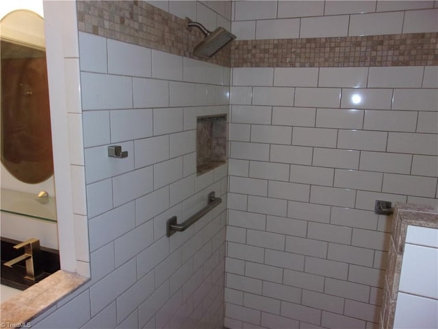 bathroom with a tile shower