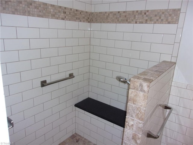 bathroom with a tile shower