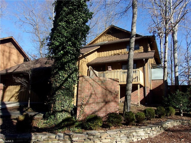 view of home's exterior with a balcony