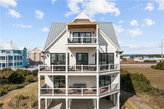 rear view of house featuring a balcony