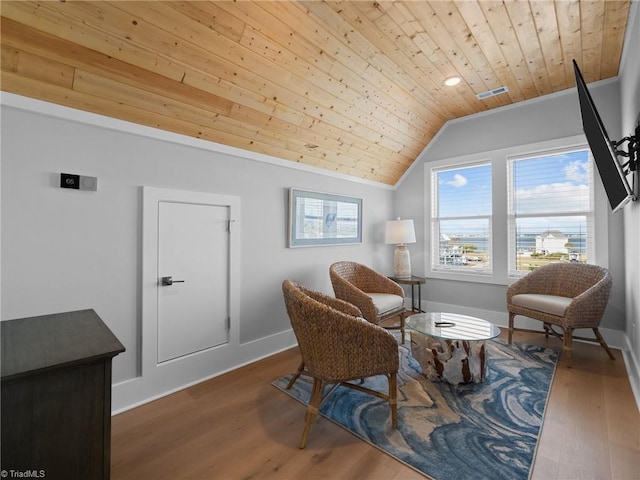 living area with dark hardwood / wood-style floors, crown molding, lofted ceiling, and wood ceiling