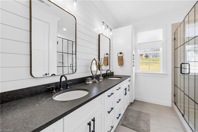 bathroom with vanity, an enclosed shower, and tile patterned flooring