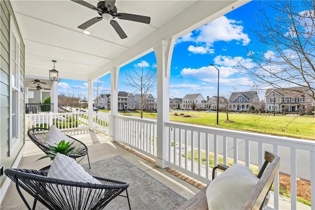 balcony featuring ceiling fan and covered porch