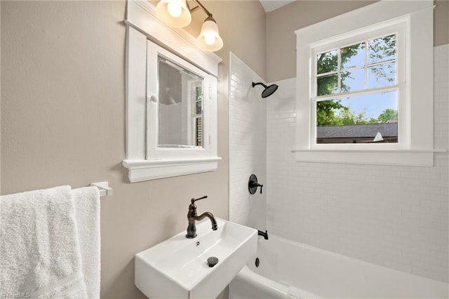 full bath featuring a sink and shower / bath combination