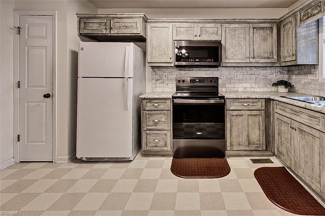 kitchen featuring backsplash, sink, and stainless steel appliances