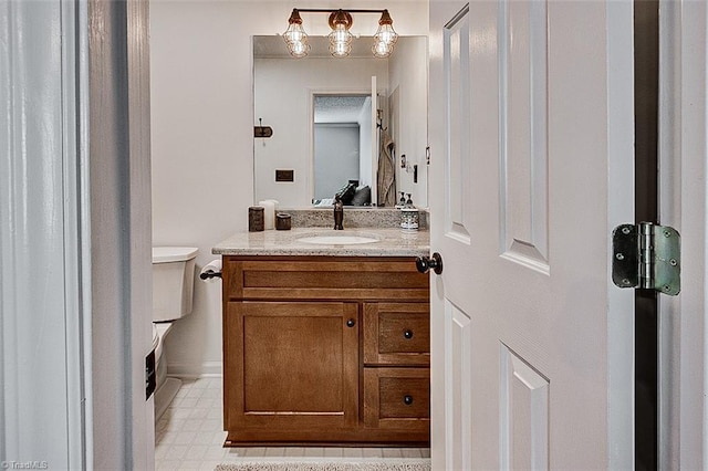 bathroom with vanity and toilet