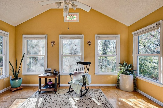 sunroom / solarium with ceiling fan and plenty of natural light