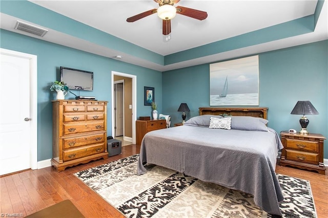 bedroom featuring wood-type flooring and ceiling fan