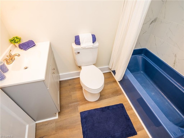 full bathroom featuring wood-type flooring, vanity, toilet, and shower / bath combination with curtain