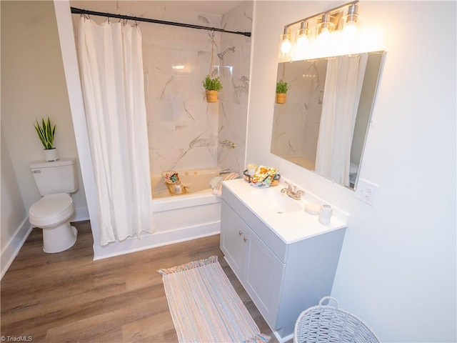 full bathroom with hardwood / wood-style floors, vanity, shower / bath combination with curtain, and toilet