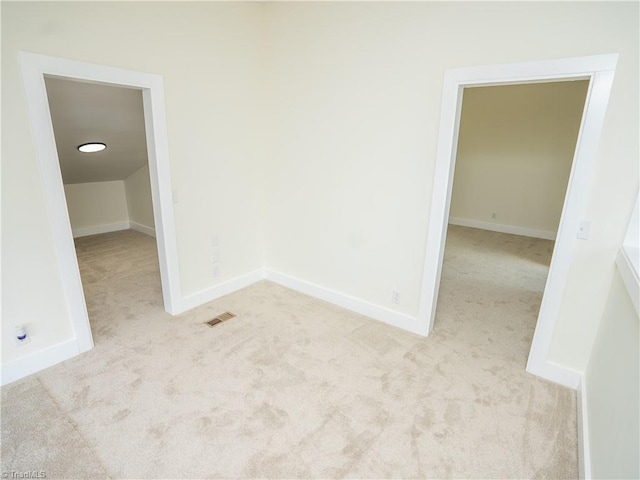 unfurnished room with light carpet