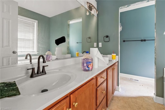 4812 Country Meadows Dr, Julian, NC 27283 - bathroom featuring double vanity and baseboards