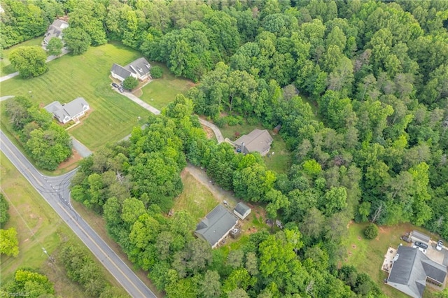 4812 Country Meadows Dr, Julian, NC 27283 - aerial view of property and surrounding area with a heavily wooded area