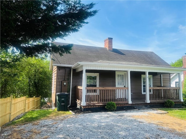 322 E Independence Blvd, Mount Airy, NC 27030 - view of front facade with a chimney, covered porch, and roof with shingles