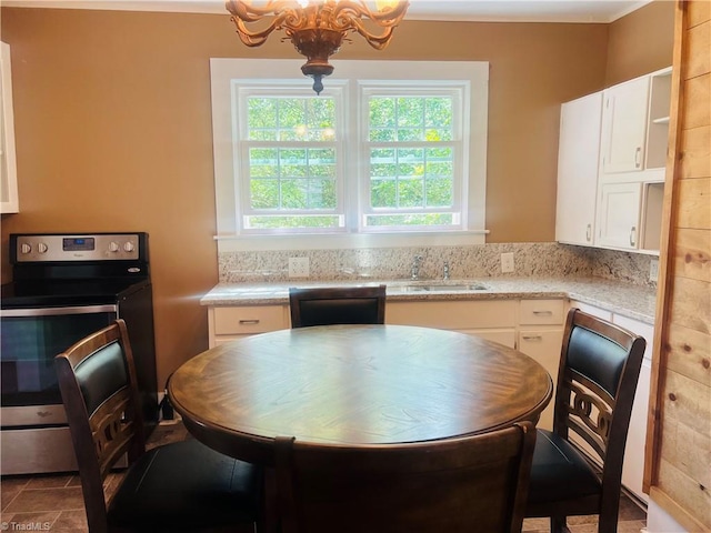 322 E Independence Blvd, Mount Airy, NC 27030 - kitchen with stainless steel electric range, white cabinets, and a chandelier