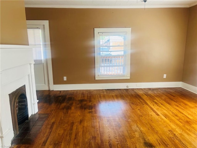 322 E Independence Blvd, Mount Airy, NC 27030 - unfurnished living room featuring crown molding, wood finished floors, and a tile fireplace