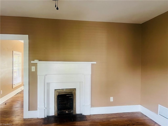 322 E Independence Blvd, Mount Airy, NC 27030 - unfurnished living room featuring a fireplace and wood finished floors