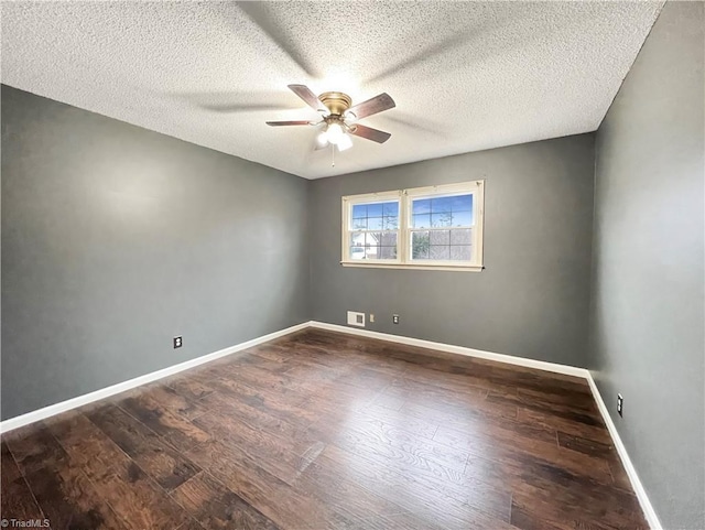 empty room with ceiling fan, a textured ceiling, and hardwood / wood-style flooring