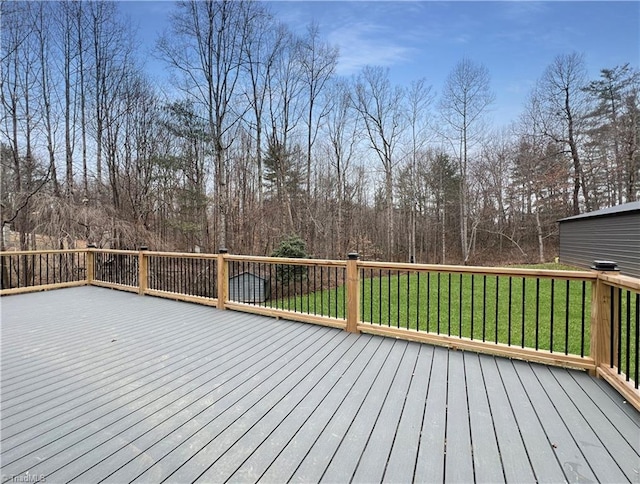 wooden deck with a lawn