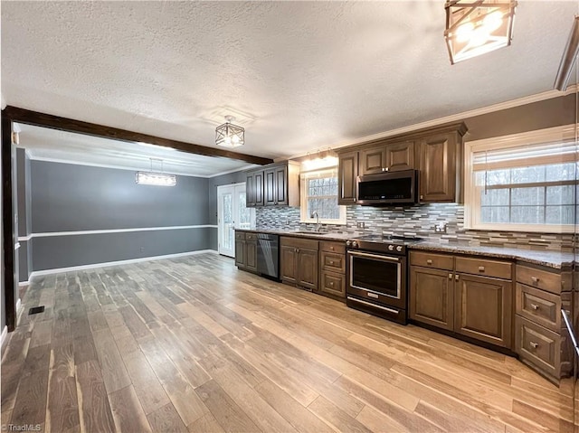 kitchen featuring stainless steel appliances, tasteful backsplash, sink, ornamental molding, and light hardwood / wood-style flooring