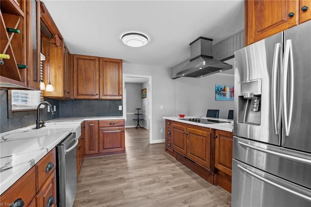 kitchen featuring appliances with stainless steel finishes, extractor fan, and brown cabinetry