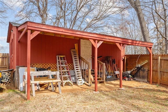 view of pole building with fence