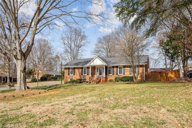 ranch-style home featuring a front lawn