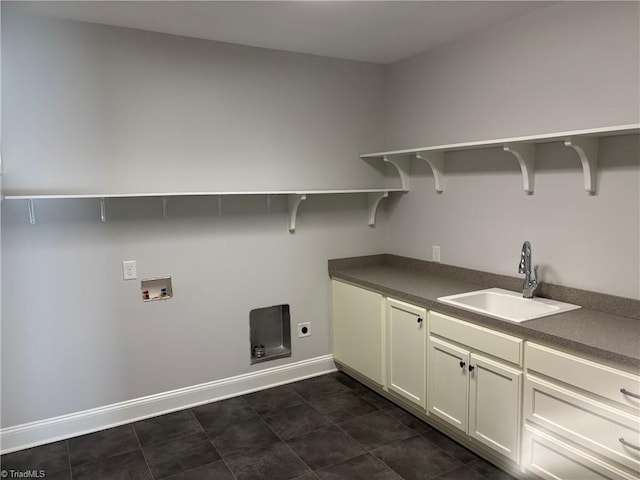 washroom featuring cabinets, hookup for an electric dryer, hookup for a washing machine, and sink