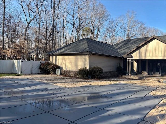 view of home's exterior featuring a covered pool