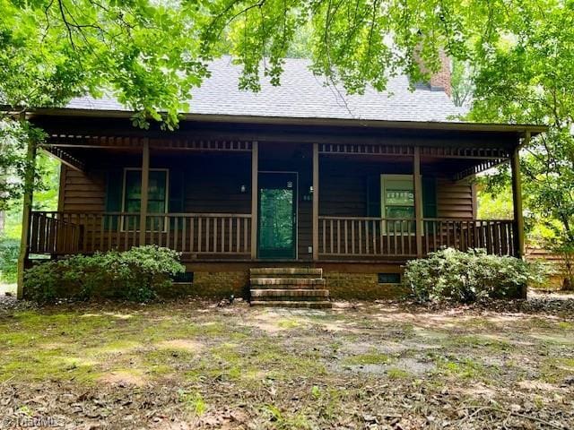 5608 Fred Lineberry Rd, Randleman, NC 27317 - view of front of property featuring a porch, a chimney, a shingled roof, and crawl space