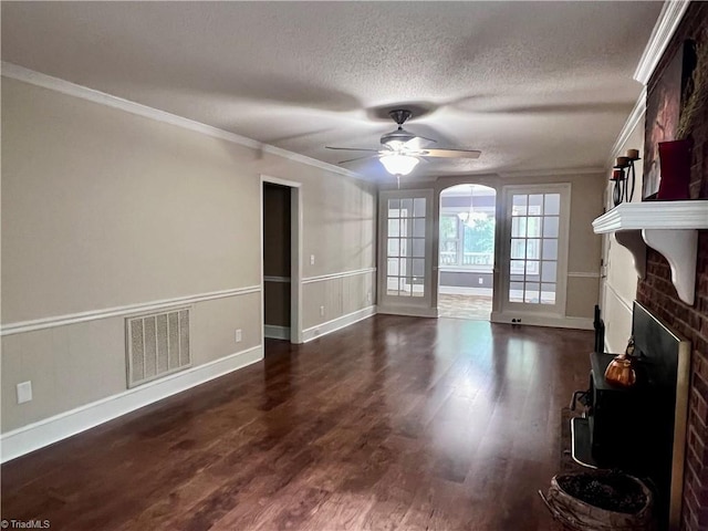 5608 Fred Lineberry Rd, Randleman, NC 27317 - unfurnished living room with a large fireplace, crown molding, baseboards, dark wood-style floors, and a ceiling fan